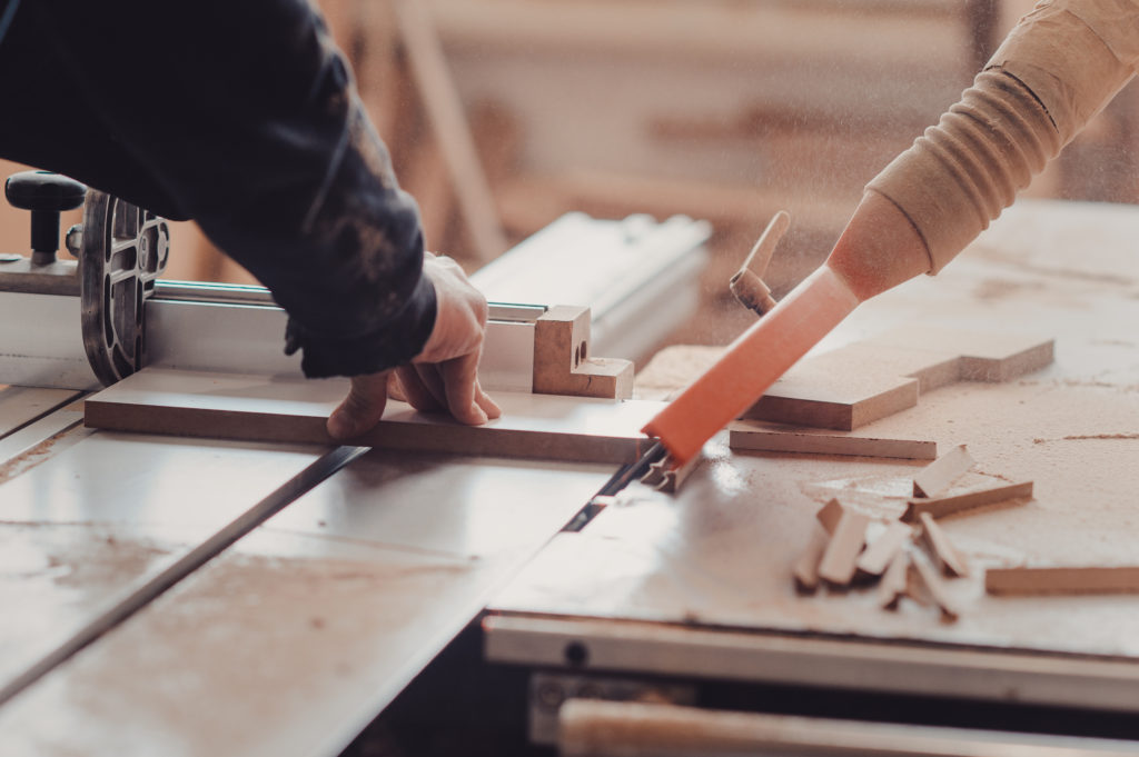 A Carpenter Works On Woodworking The Machine Tool. Carpenter Wor