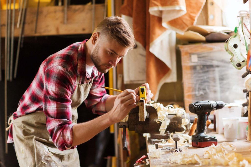 profession, carpentry, woodwork and people concept - carpenter w